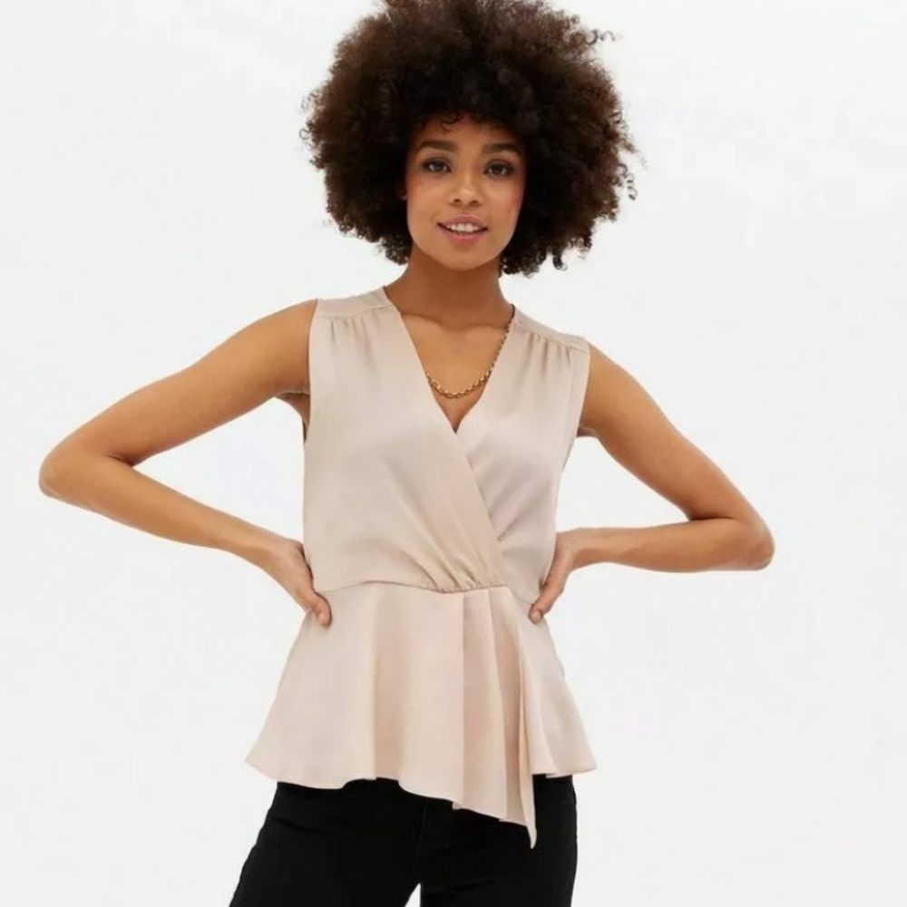 New 
 Pale pink faux wrap satin kind ,top in USA SIZE 10 ,UK size 14